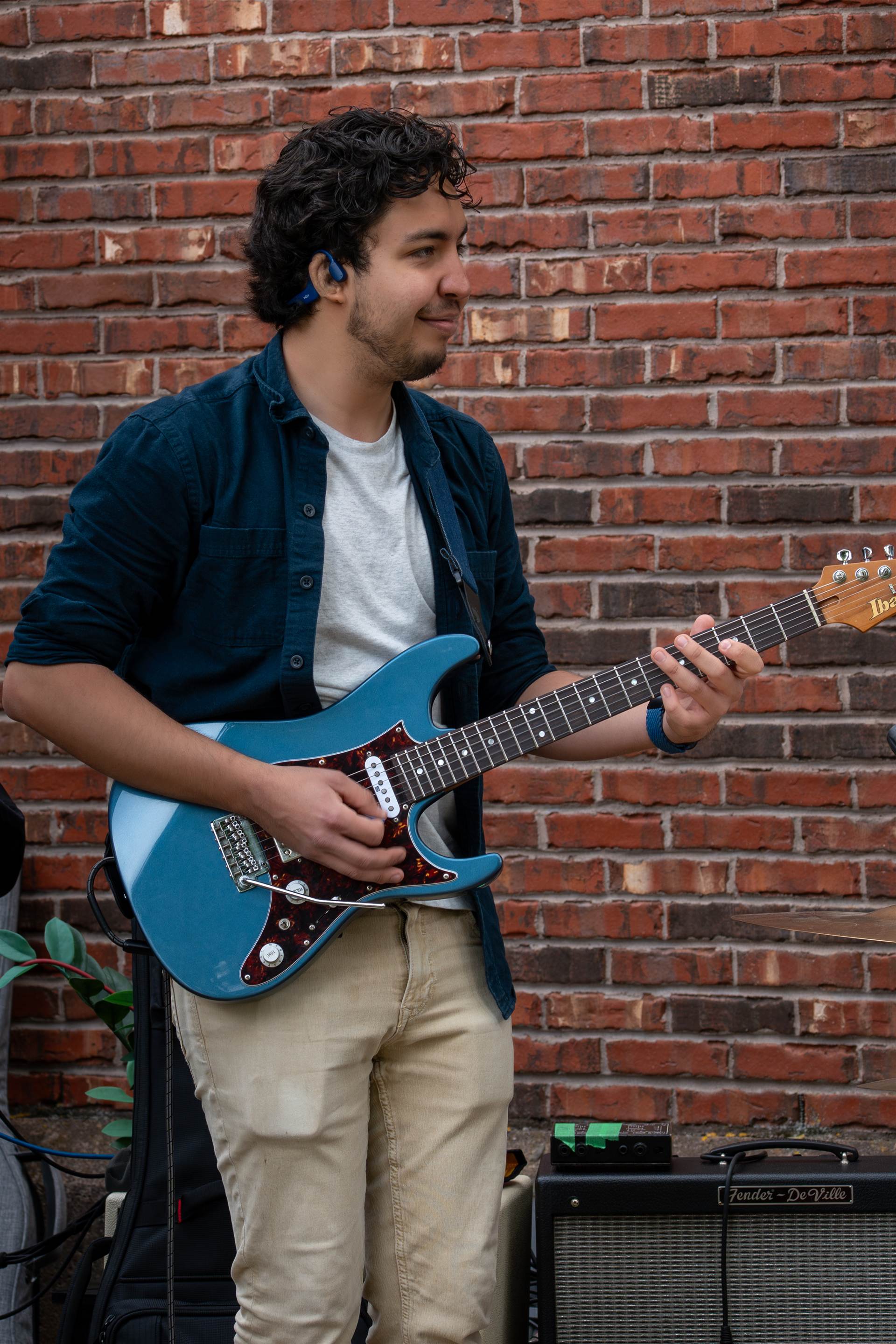 Musicians playing live at a lively Prince Edward Island outdoor concert - Eastside Photography band promo