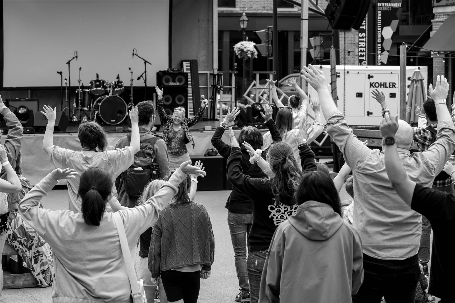 Packed crowd dancing and enjoying live music atmosphere at a major Prince Edward Island summer festival - Eastside Photography