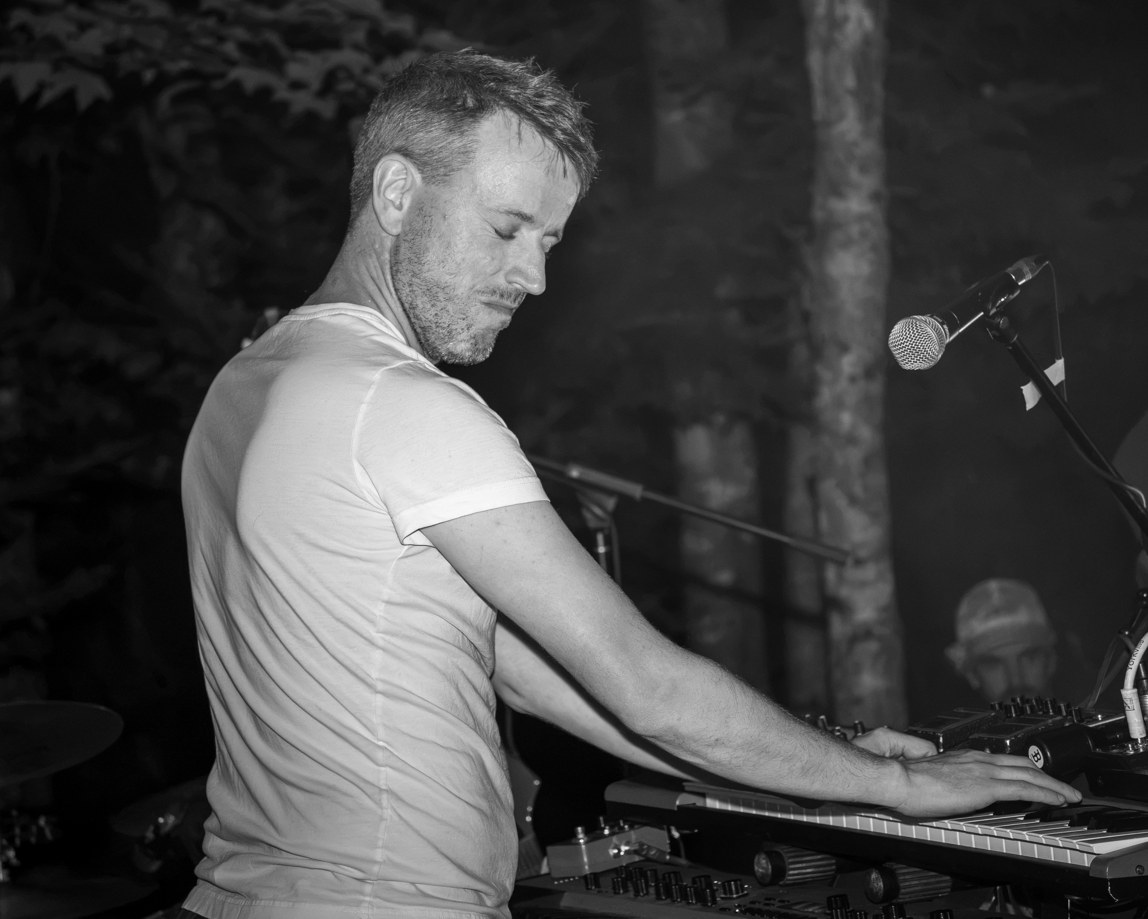 Live DJ performance with vibrant stage lighting at a Prince Edward Island nightlife event - Eastside Photography