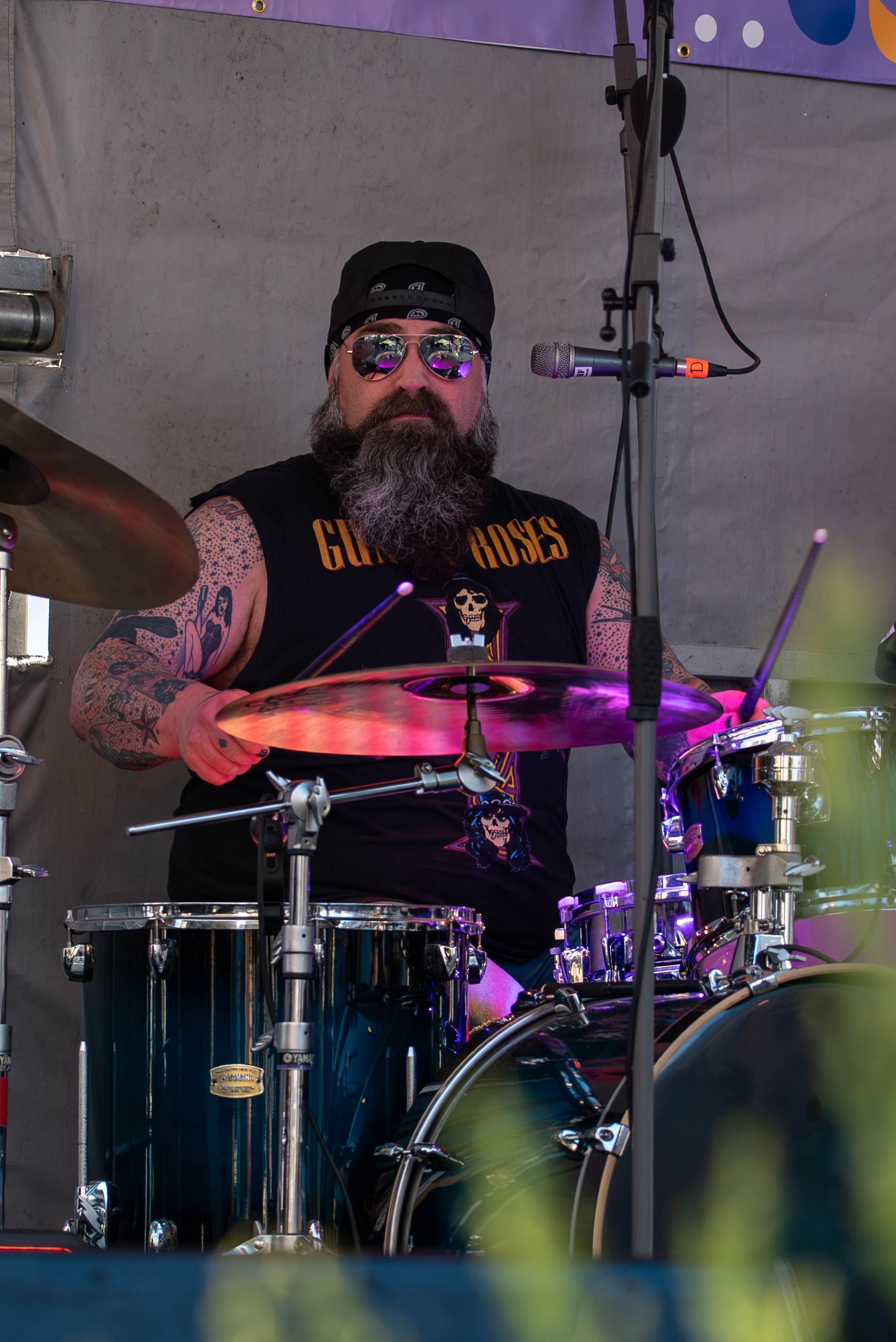 Musicians playing live at a lively Prince Edward Island outdoor concert - Eastside Photography band promo