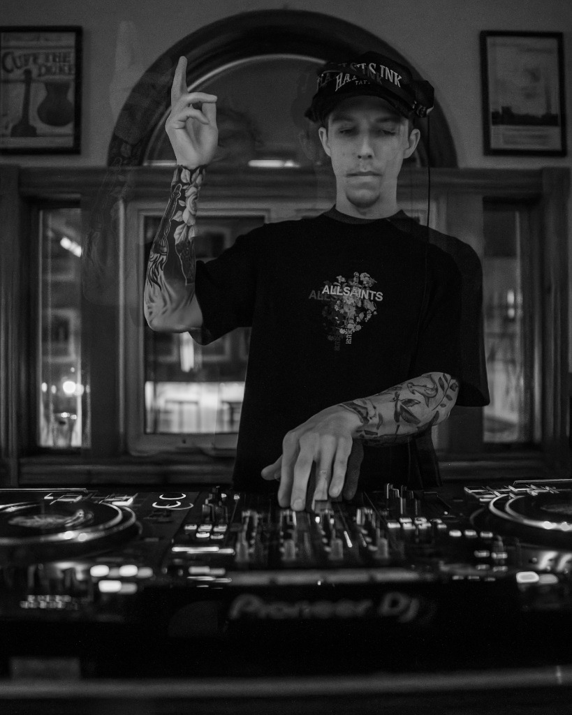 Black and white close-up of a DJ mixing on high-end Pioneer DJ decks in Prince Edward Island - Eastside Photography