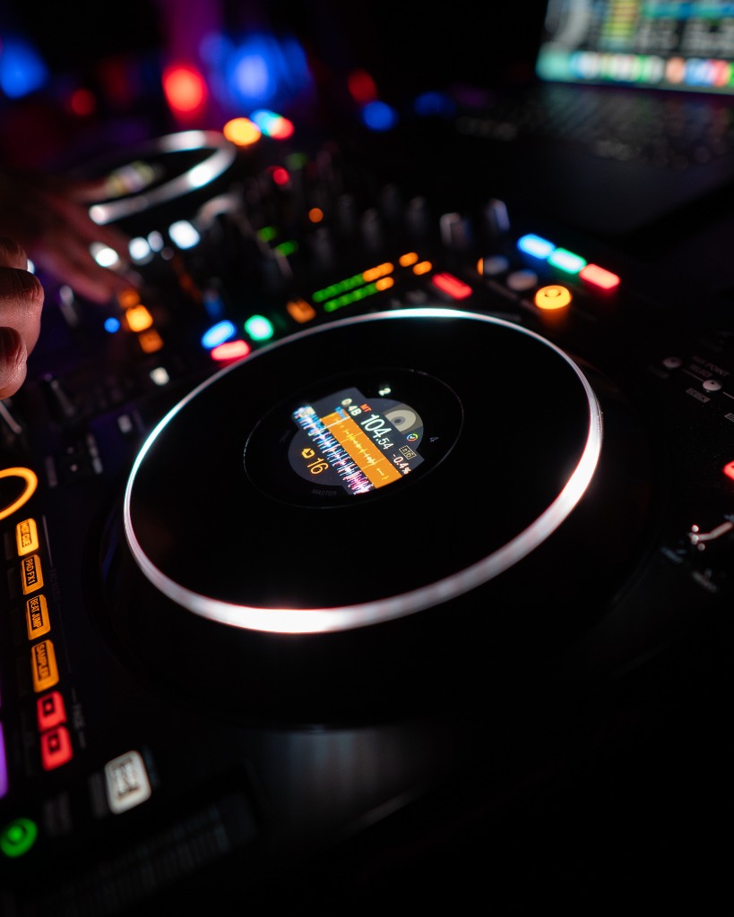 Close-up of a Pioneer DJ turntable controller and jog wheel in action at a PEI club event - Eastside Photography behind the scenes