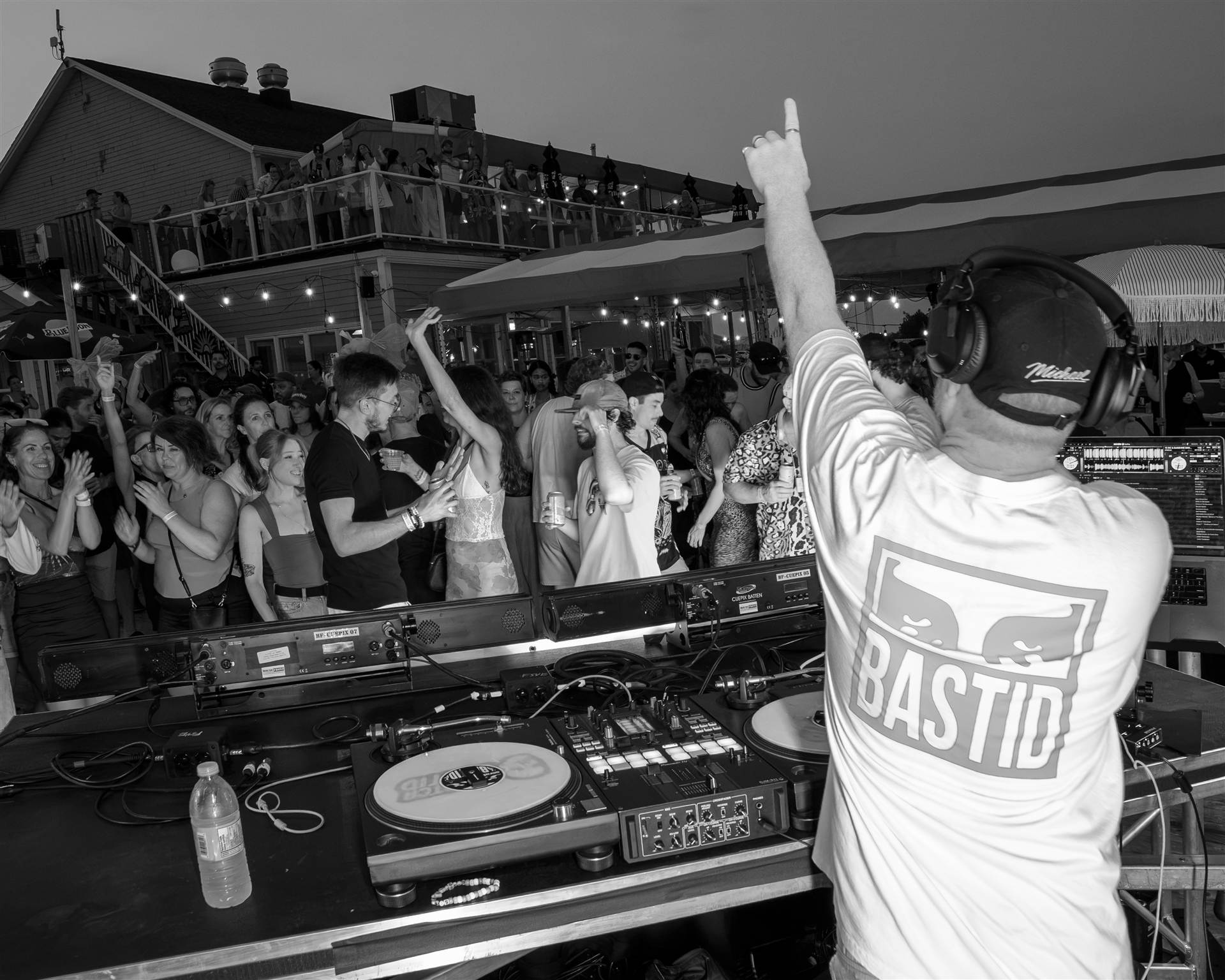 Female DJ smiling at Moosehead backdrop Serato controller outdoor event PEI - Eastside Photography