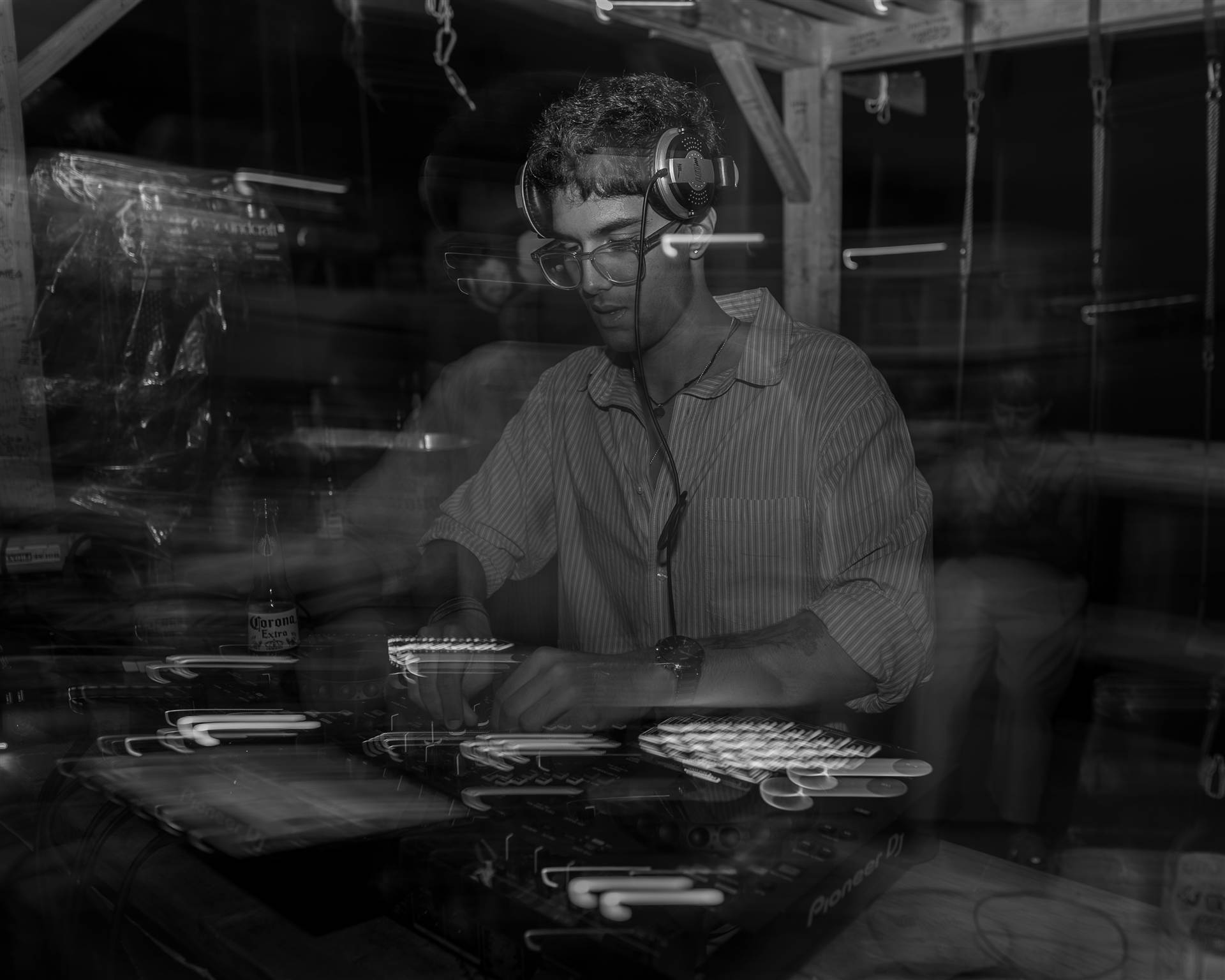DJ smiling adjusting headphones close-up portrait long-exposure Sundrift festival PEI - Eastside Photography