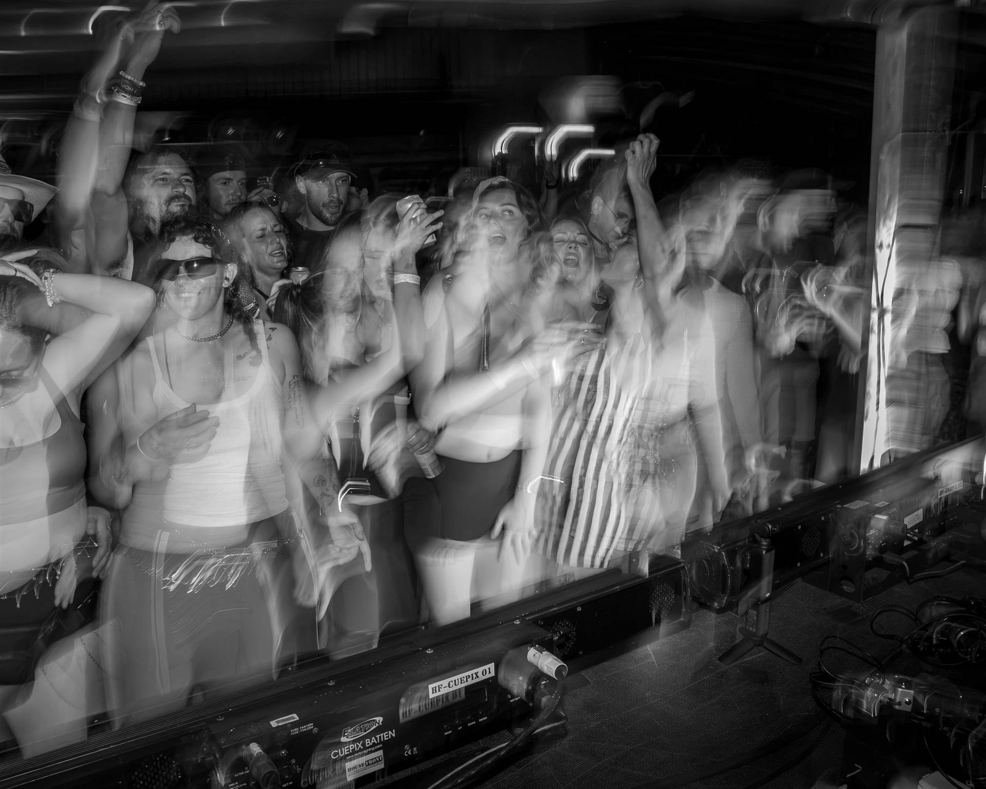 People dancing indoors at Sundrift Sound Festival crowd shot black and white PEI - Eastside Photography